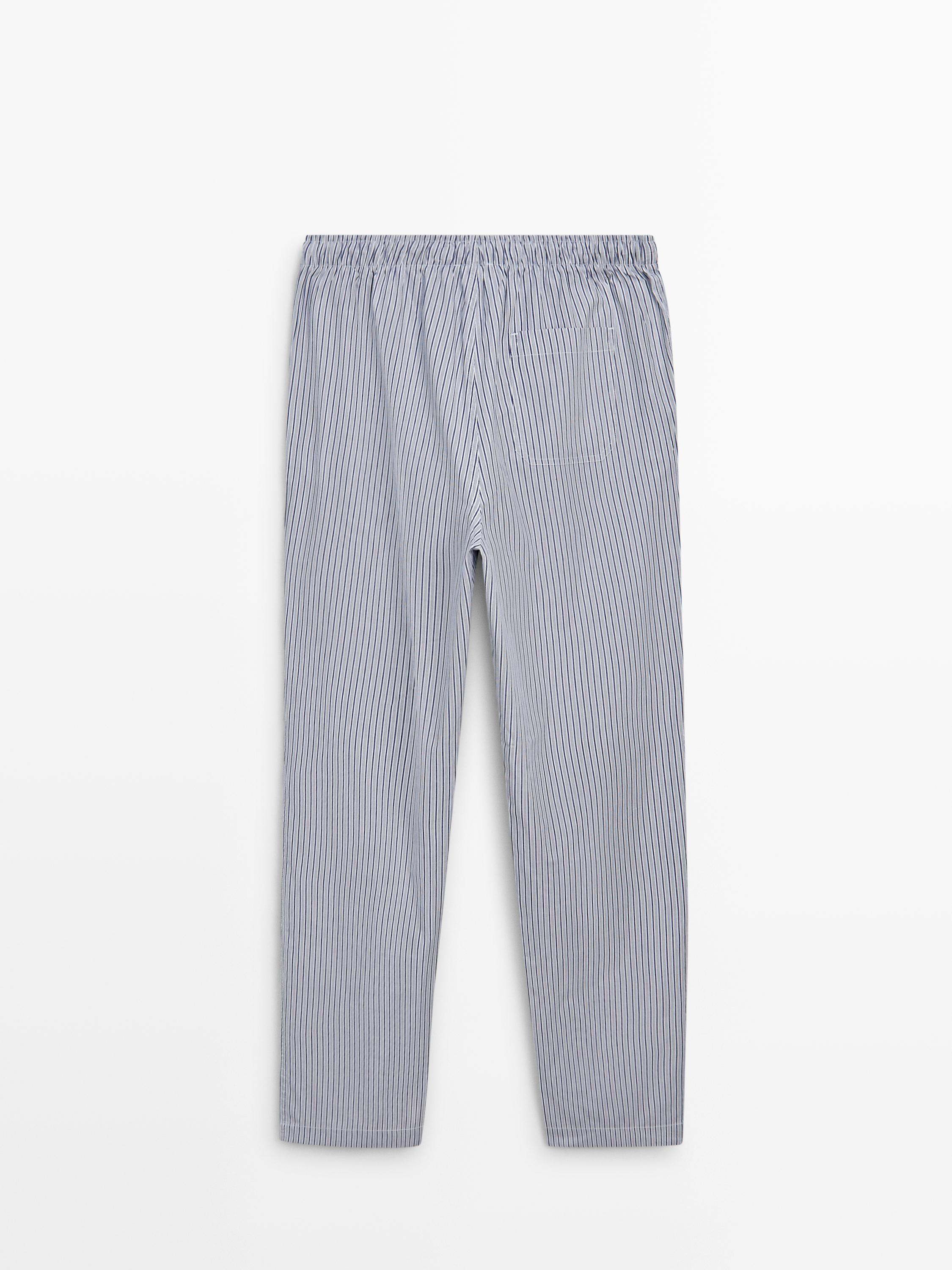 Short sleeve pyjama top and striped trousers